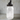 Clear glass jar with a decorative metal lid featuring a dog design on a white background