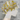 Patterned shower cap on a mannequin head with a white background