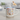 Mug with 'Dogs make life better' text and floral design on a table in a living room.