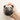 Close-up of a person squeezing a squishy pug dog stress ball for relaxation.