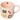 Pink mug with Christmas-themed illustrations on a white background