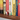 Close-up of dog-themed magnetic bookmarks clipped onto book pages, showing their vibrant design.