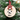 Wooden ornament with a paw print and name 'Max' hanging on a Christmas tree.