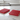 Two red silicone mold trays with bone-shaped cavities on a white background