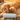 Small dog playing with the Birthday Candle Dog Toy, shaking it with excitement.