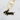 Black dachshund keychain with gold accents shown on white background