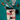 A Christmas-themed tote bag featuring a dachshund wearing a red and white striped sweater and beret, styled on a teal background with holiday props including a red-and-white striped beaded garland, plush toys, and matching socks.