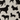 Pattern of black dog silhouettes on a beige background