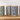 Set of five ceramic pet food containers with dog pattern lids on a wooden surface.