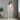 Woman wearing a patterned outfit with a white background