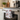 Decorative towel with patriotic design hanging on a kitchen oven handle.