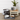 Pet accessories including bowls, a mat, and a small table with a plant and mug on a wooden floor.