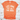 Orange t-shirt with 'Life Goal Pet All The Dogs' text on a wooden surface