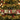 Five square Christmas dog-themed hanging cards are strung on a decorated Christmas tree with gold tinsel and red berries. The cards feature different dog illustrations and holiday quotes on a red, green, and beige background.