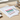 Pack of Weenie page markers with colorful dachshund shapes on a beige background